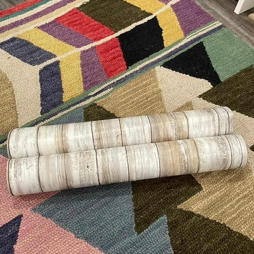 Two rolls of faux wood removable wallpaper